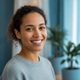 A happy person in their late 20s to early 30s smiles, conveying trust and satisfaction.